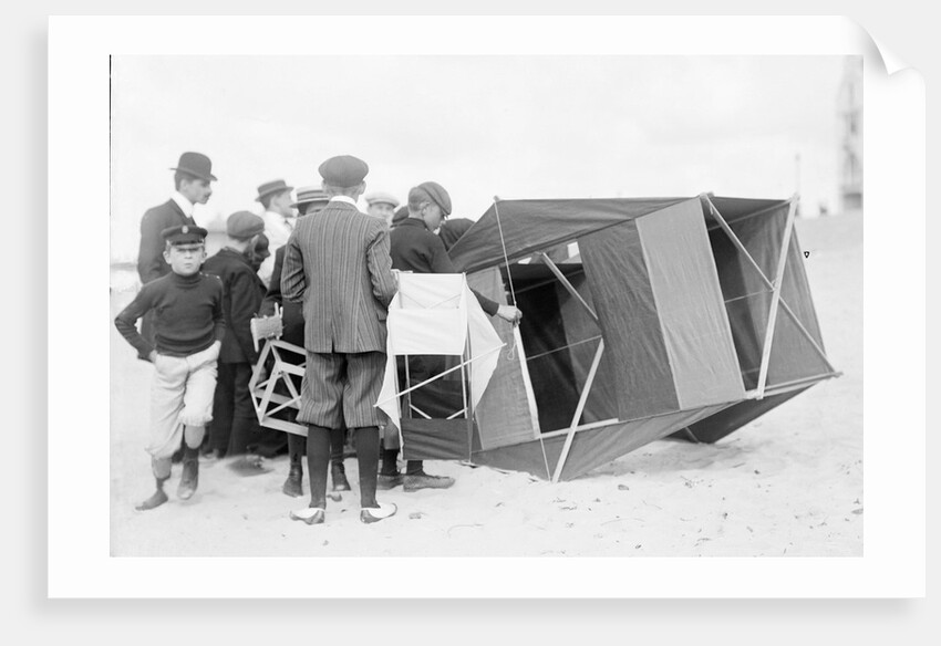 Large black box kite grounded by Andrew Pitcairn-Knowles
