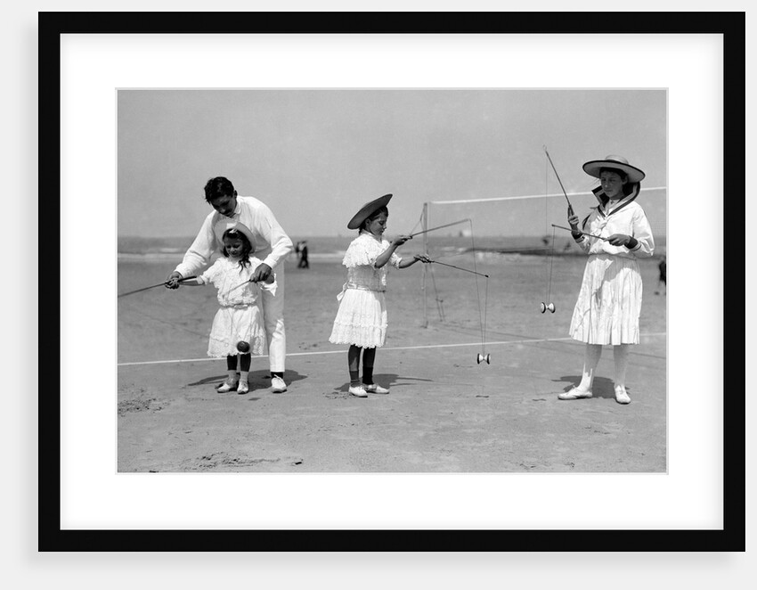 Man and Three Children, Diabolo over a net by Andrew Pitcairn-Knowles