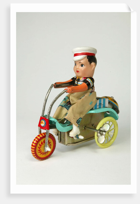 Clockwork toy boy on a tricycle by Unknown