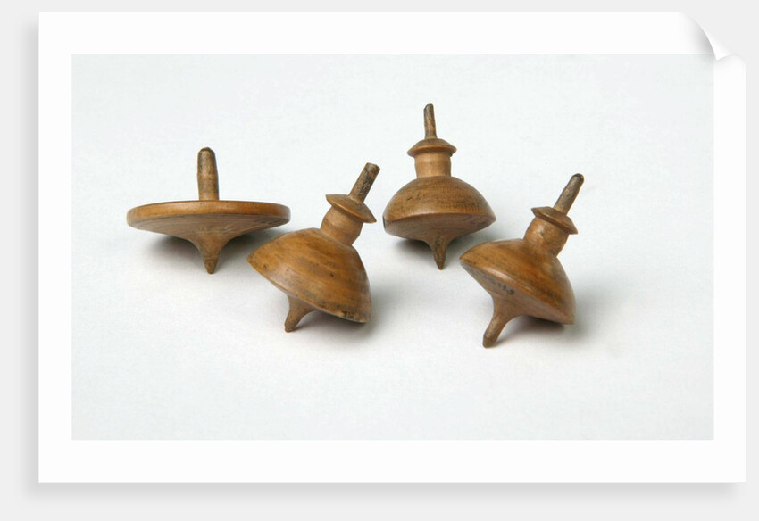 Miniature spinning tops by Unknown
