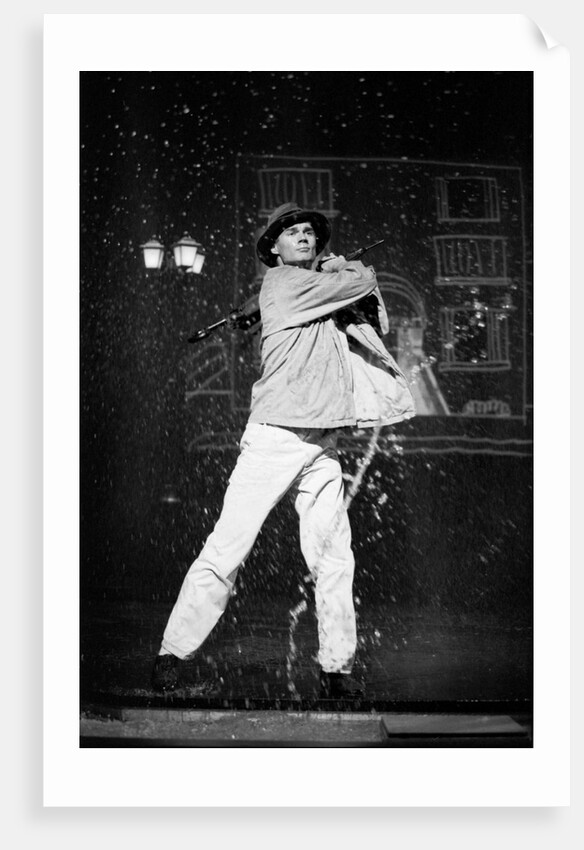 Paul Robinson in Betty Comden and Adolph Green's SinginÆ in the Rain at the National Theatre by Graham Brandon