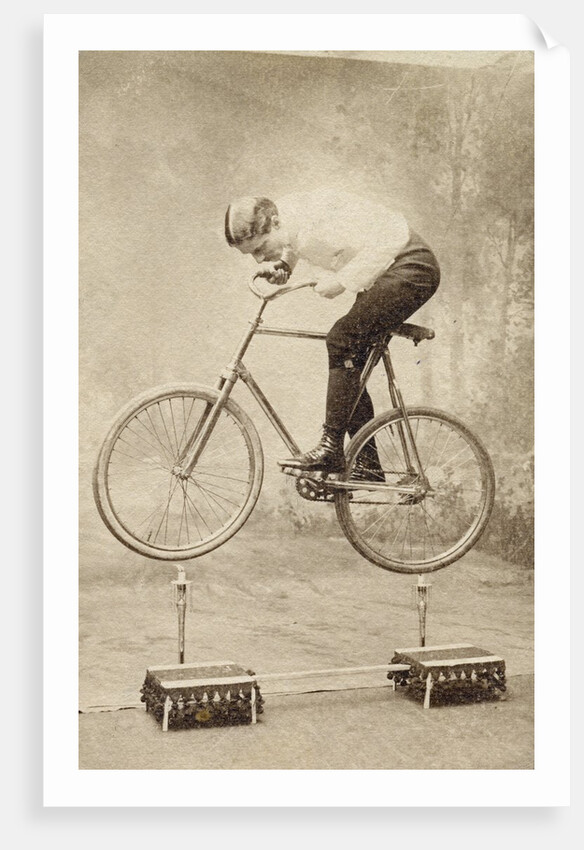 Trick Cyclist Balancing on Candles by Anonymous