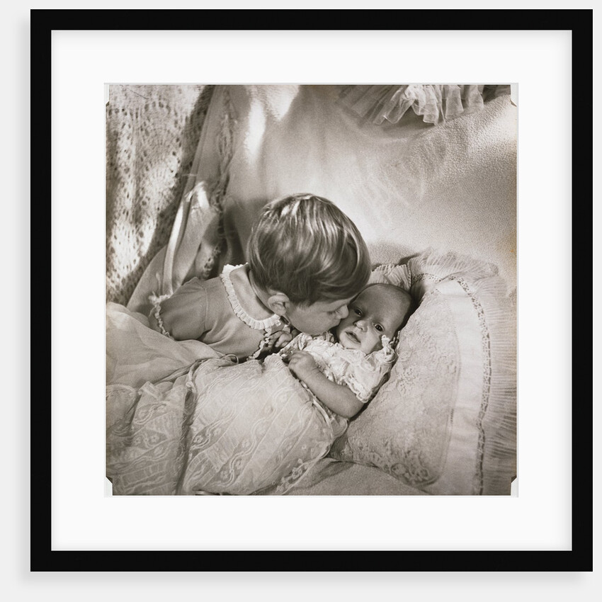 Prince Charles at the age of 18 months, kissing baby Princess Anne by Cecil Beaton