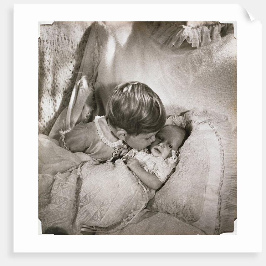 Prince Charles at the age of 18 months, kissing baby Princess Anne by Cecil Beaton