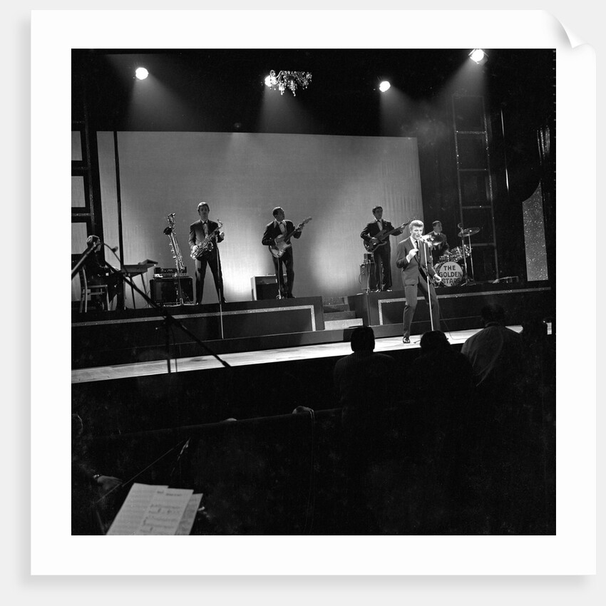 Johnny Hallyday with band performing on the Palladium Stage by Harry Hammond