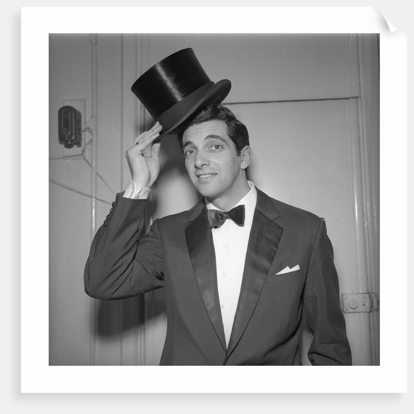 Frankie Vaughan posing with a hat by Harry Hammond