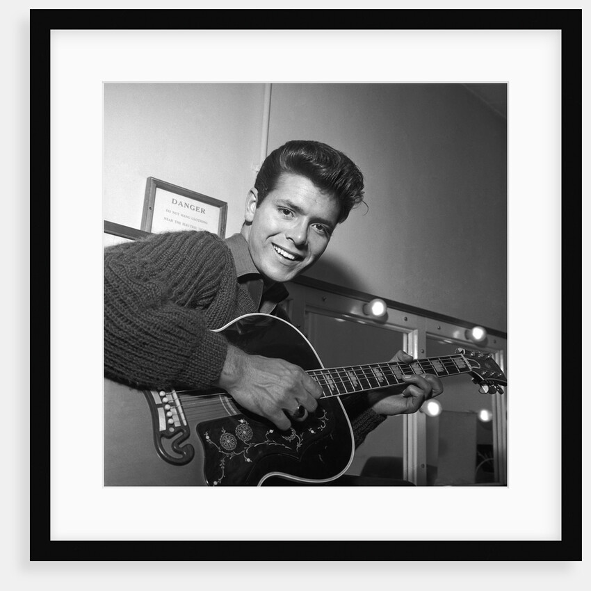 Cliff Richard with guitar by Harry Hammond