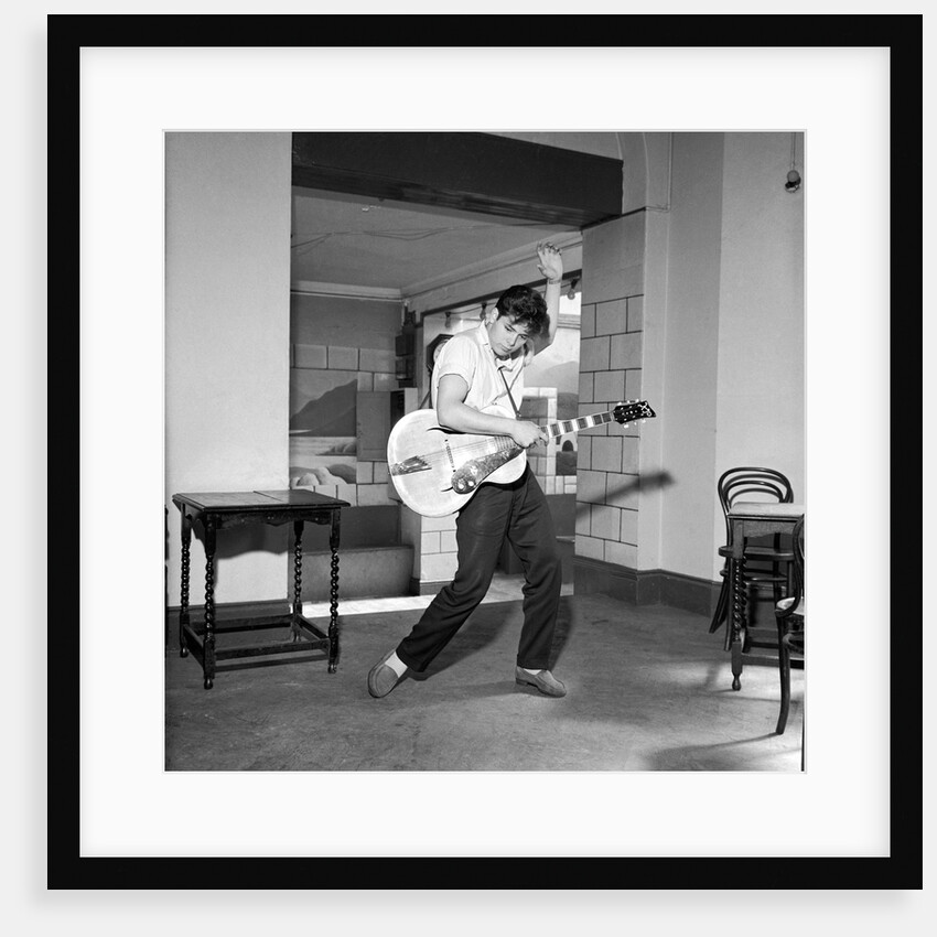 Cliff Richard playing the guitar by Harry Hammond