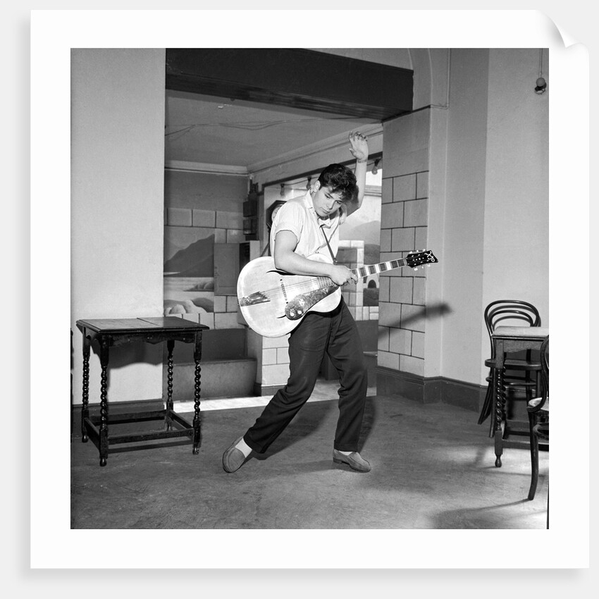 Cliff Richard playing the guitar by Harry Hammond