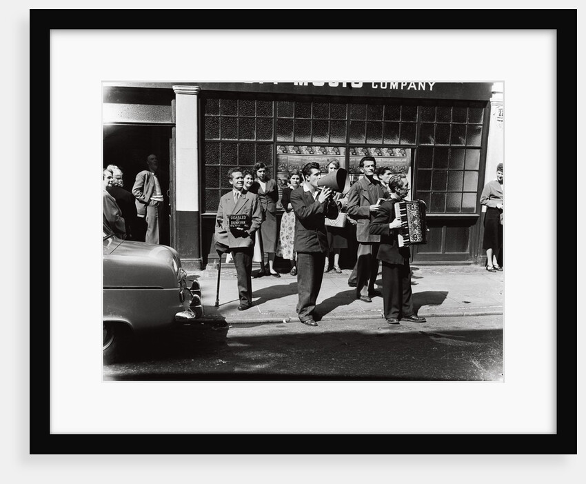 Danny Purches with a group of people by Harry Hammond