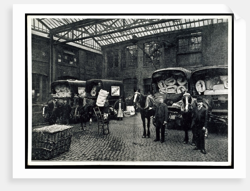 Loading up new matresses for delivery in the yard of Torrington Place by Unknown