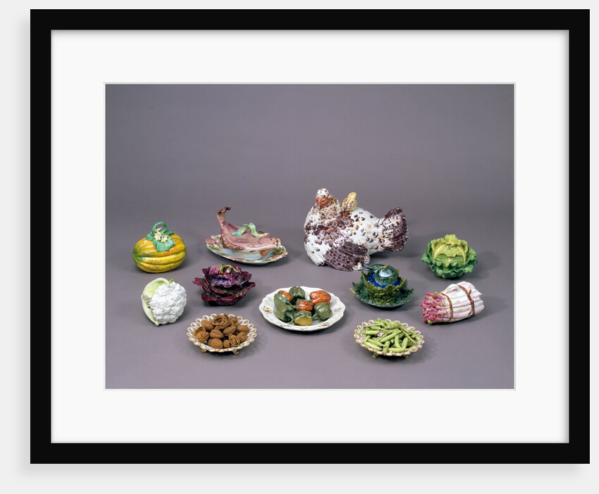 Arrangement of ceramic tureens and trick plates in the shape of vegetables and other food by Unknown