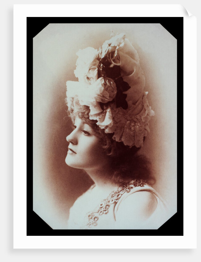Belle Bilton wearing an ornate hat by Alexander Bassano