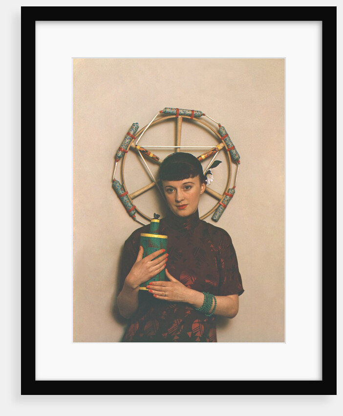 Woman in eastern dress with fireworks by Curtis Moffat
