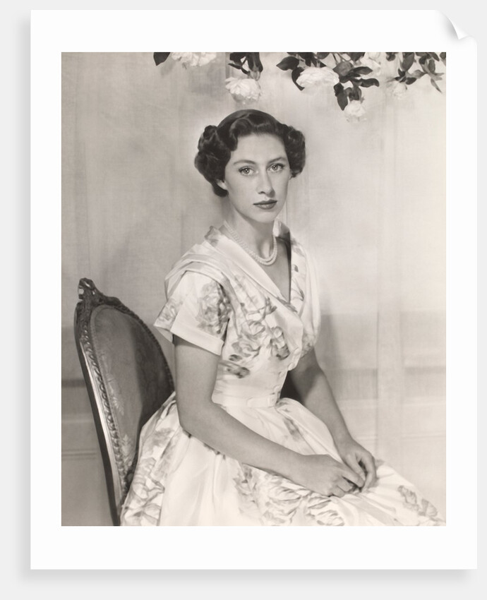 Princess Margaret sitting on a chair by Cecil Beaton