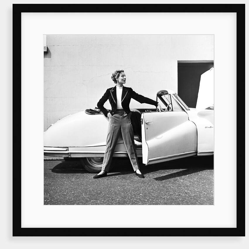Model beside open door of Austin of England A90 Atlantic Sports saloon convertible by Elsbeth Juda