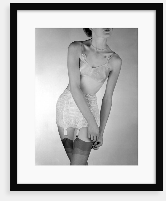 Model wearing girdle with suspender belt by John French