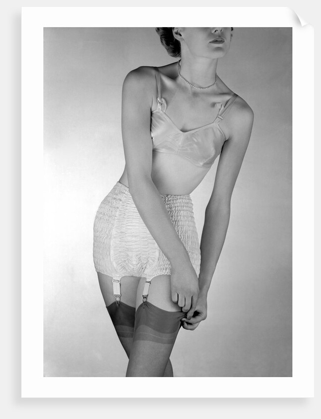 Model wearing girdle with suspender belt by John French