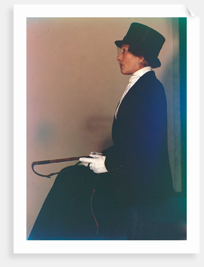 Woman in top hat sitting by Curtis Moffat