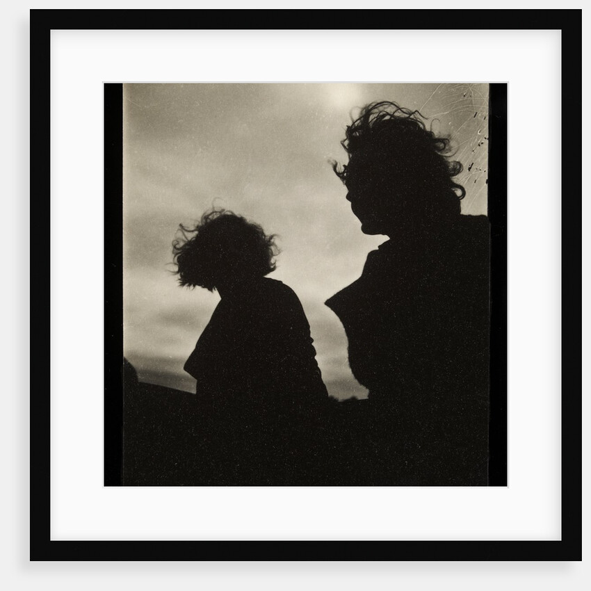 Silhouette of two women hair blown by wind sitting in wooden boat by Curtis Moffat