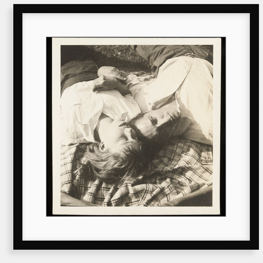 Man and woman lying head by head on rug on grass by Curtis Moffat