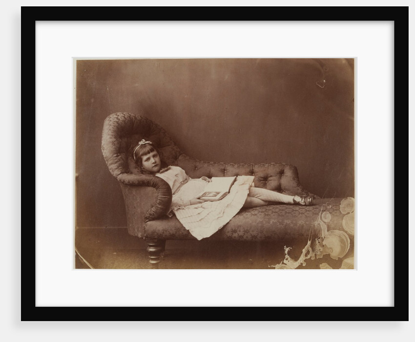 Xie Kitchin on sofa by Charles Lutwidge Dodgson