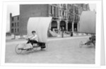 Boys racing on the promenade by Andrew Pitcairn-Knowles