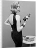 Model holding bottle of poison by John French