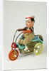 Clockwork toy boy on a tricycle by Unknown