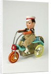 Clockwork toy boy on a tricycle by Unknown