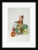 Clockwork toy boy on a tricycle by Unknown