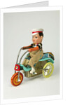 Clockwork toy boy on a tricycle by Unknown