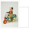 Clockwork toy boy on a tricycle by Unknown