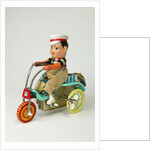 Clockwork toy boy on a tricycle by Unknown