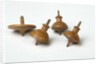 Miniature spinning tops by Unknown