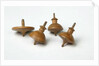 Miniature spinning tops by Unknown
