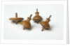 Miniature spinning tops by Unknown