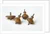 Miniature spinning tops by Unknown