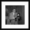Chubby Checker holding a record by Harry Hammond