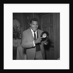 Chubby Checker holding a record by Harry Hammond