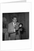 Chubby Checker holding a record by Harry Hammond