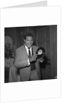 Chubby Checker holding a record by Harry Hammond