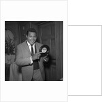 Chubby Checker holding a record by Harry Hammond