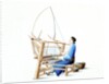 Woman weaving cotton by Unknown