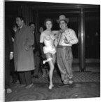 Tony Hancock with showgirl by Harry Hammond