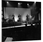 Johnny Hallyday with band performing on the Palladium Stage by Harry Hammond