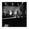 Johnny Hallyday with band performing on the Palladium Stage by Harry Hammond