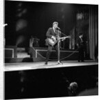 Johnny Hallyday with band performing on the Palladium Stage by Harry Hammond