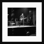 Johnny Hallyday with band performing on the Palladium Stage by Harry Hammond