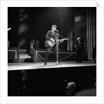 Johnny Hallyday with band performing on the Palladium Stage by Harry Hammond